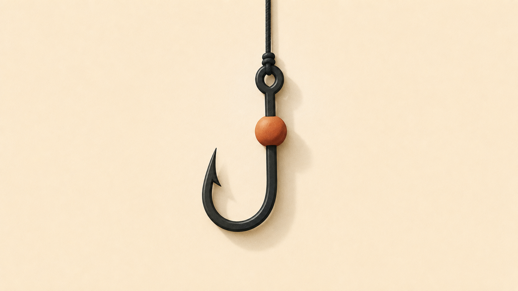 A single fishing hook with one small bead on it